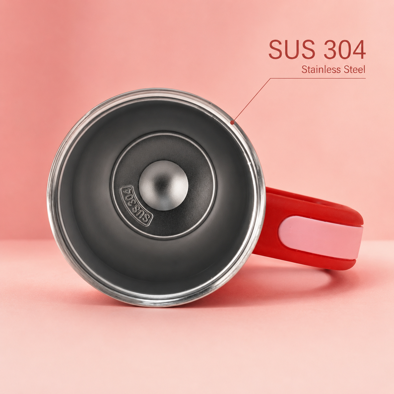 Stainless steel pot with red handle on a pink background, featuring SUS 304 text.